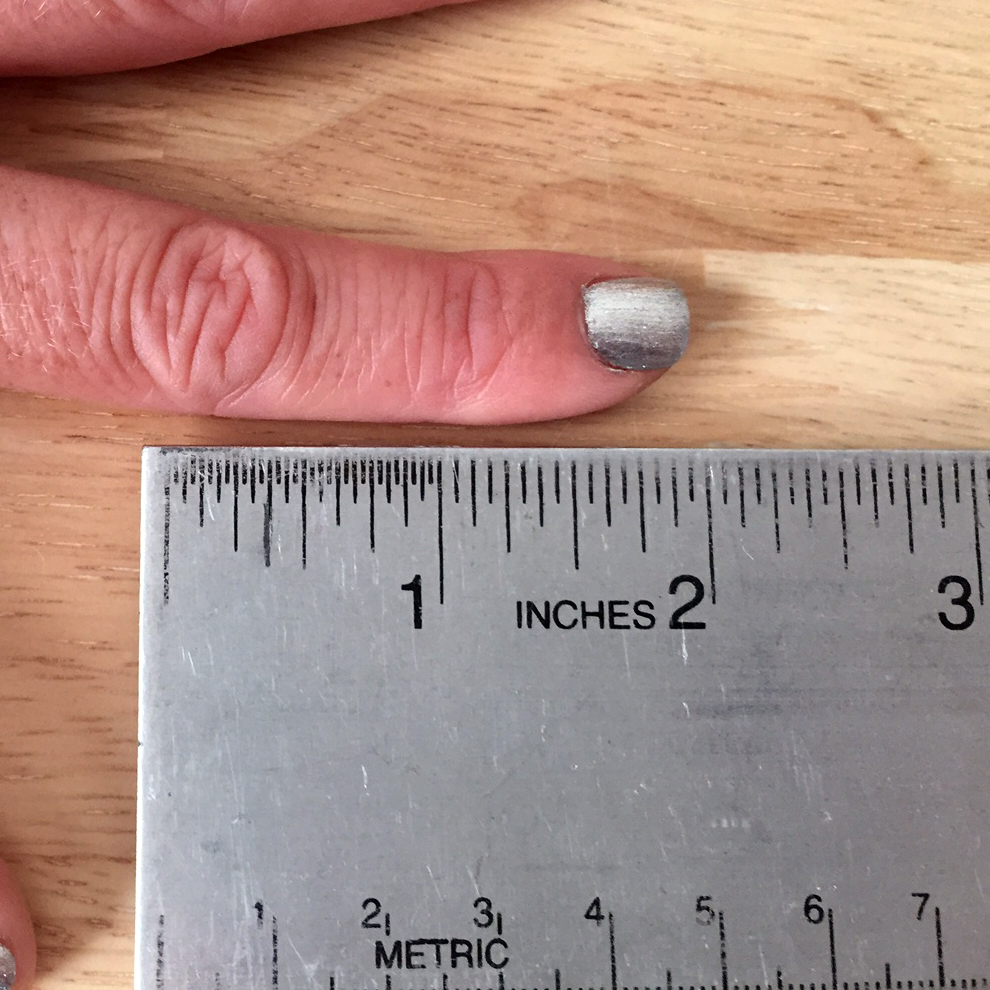 2" measurement from 2nd knuckle to finger tip