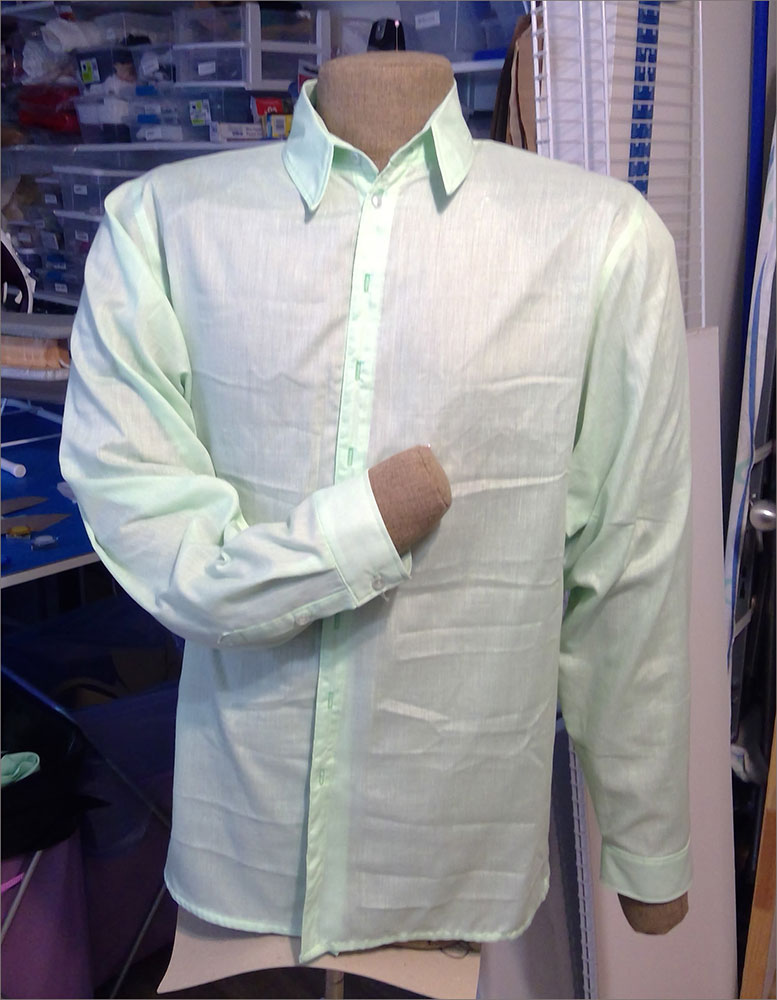 A person standing in front of a store
Description automatically generated